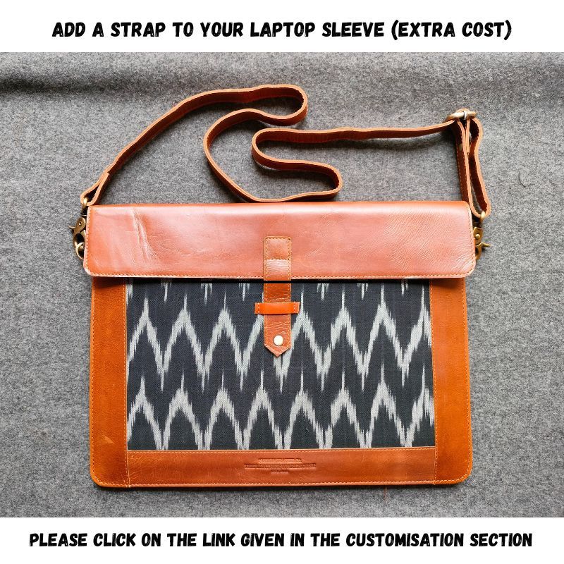 Laptop sleeve with brown leather trim and patterned fabric on a gray background
