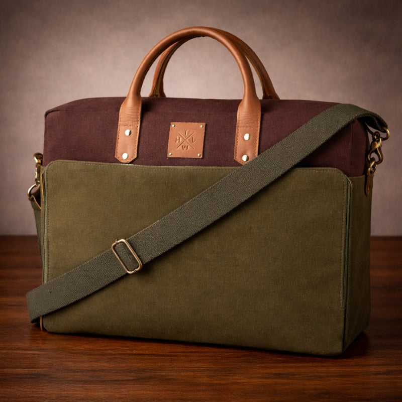 Green and brown bag with canvas & leather handles on a wooden surface