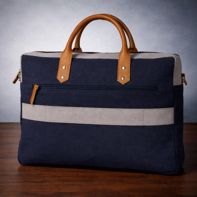 Navy blue canvas bag with beige accents on a wooden surface