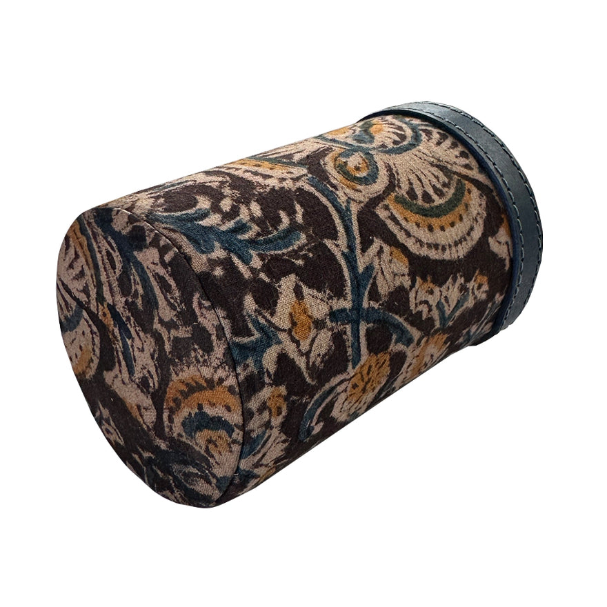 Decorative cylindrical pillow with intricate pattern on a white background