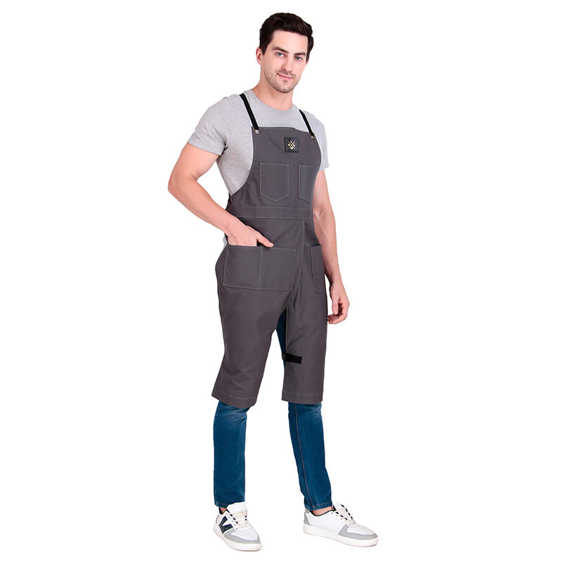 Man wearing gray overalls on a white background