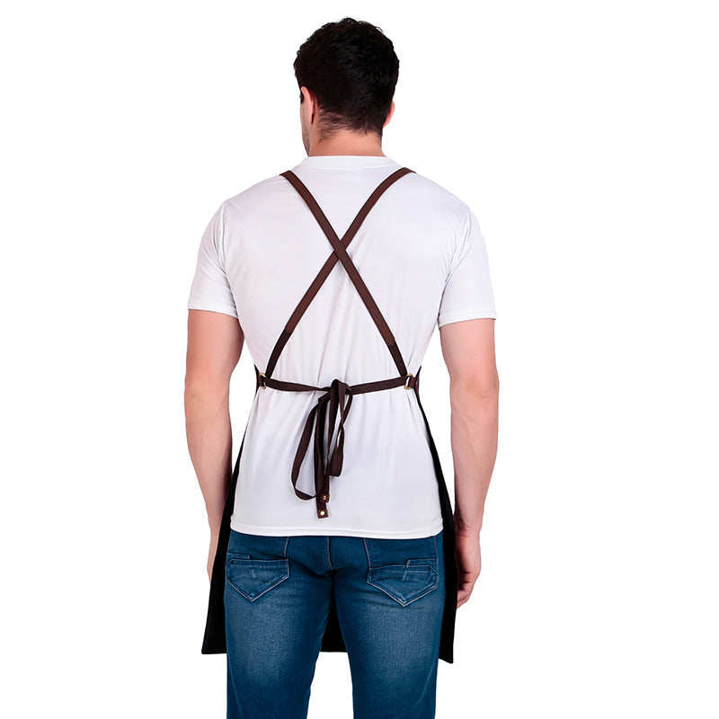 Person wearing a white shirt and blue jeans with a brown apron over their shoulders on a white background