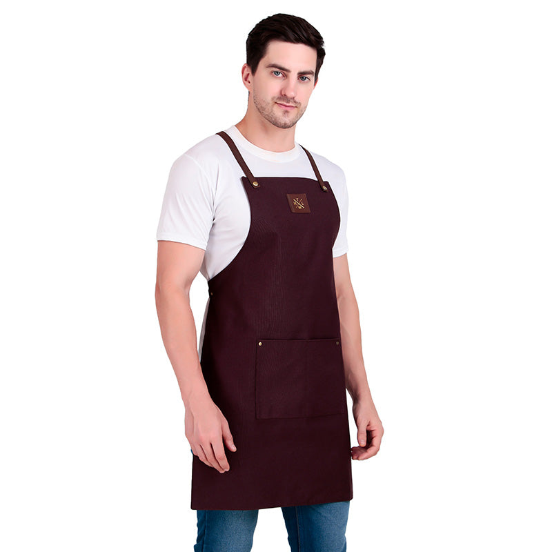 Man wearing a brown apron on a white background