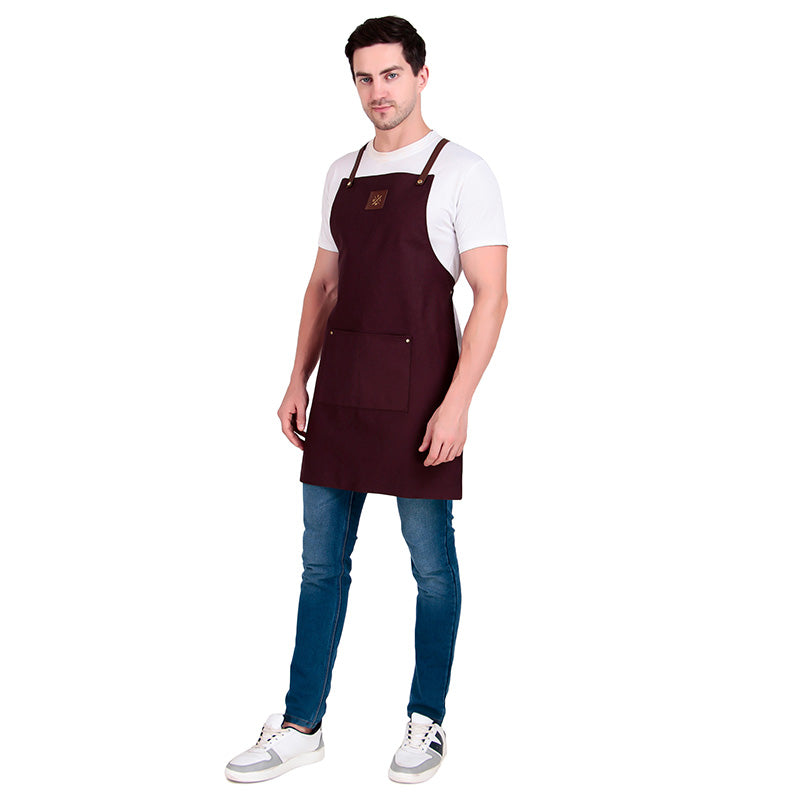 Man wearing a brown apron on a white background