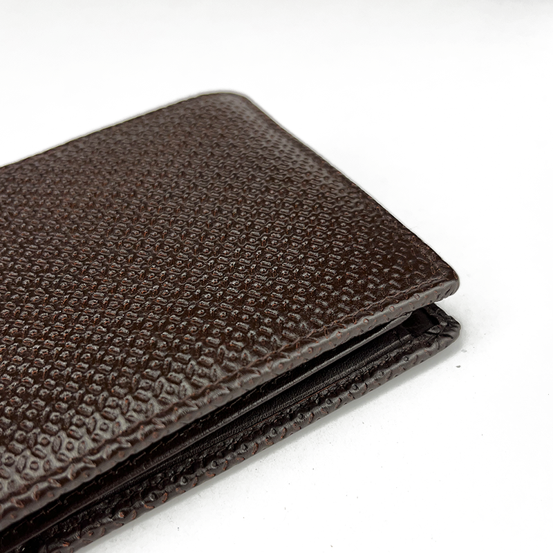 Brown textured leather wallet on a white background