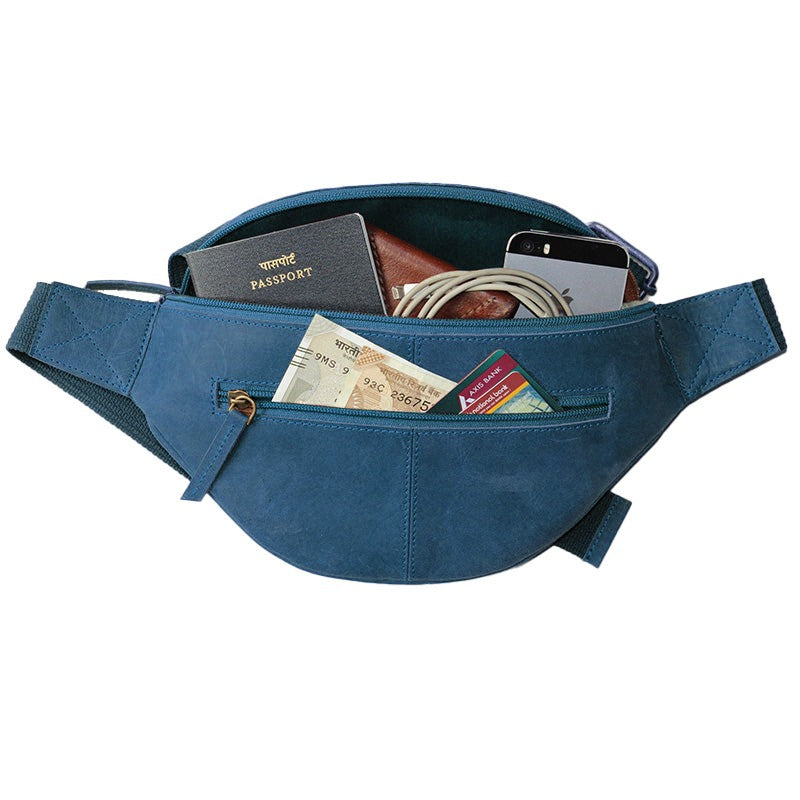 Blue waist bag with various items including a passport and cards on a white background