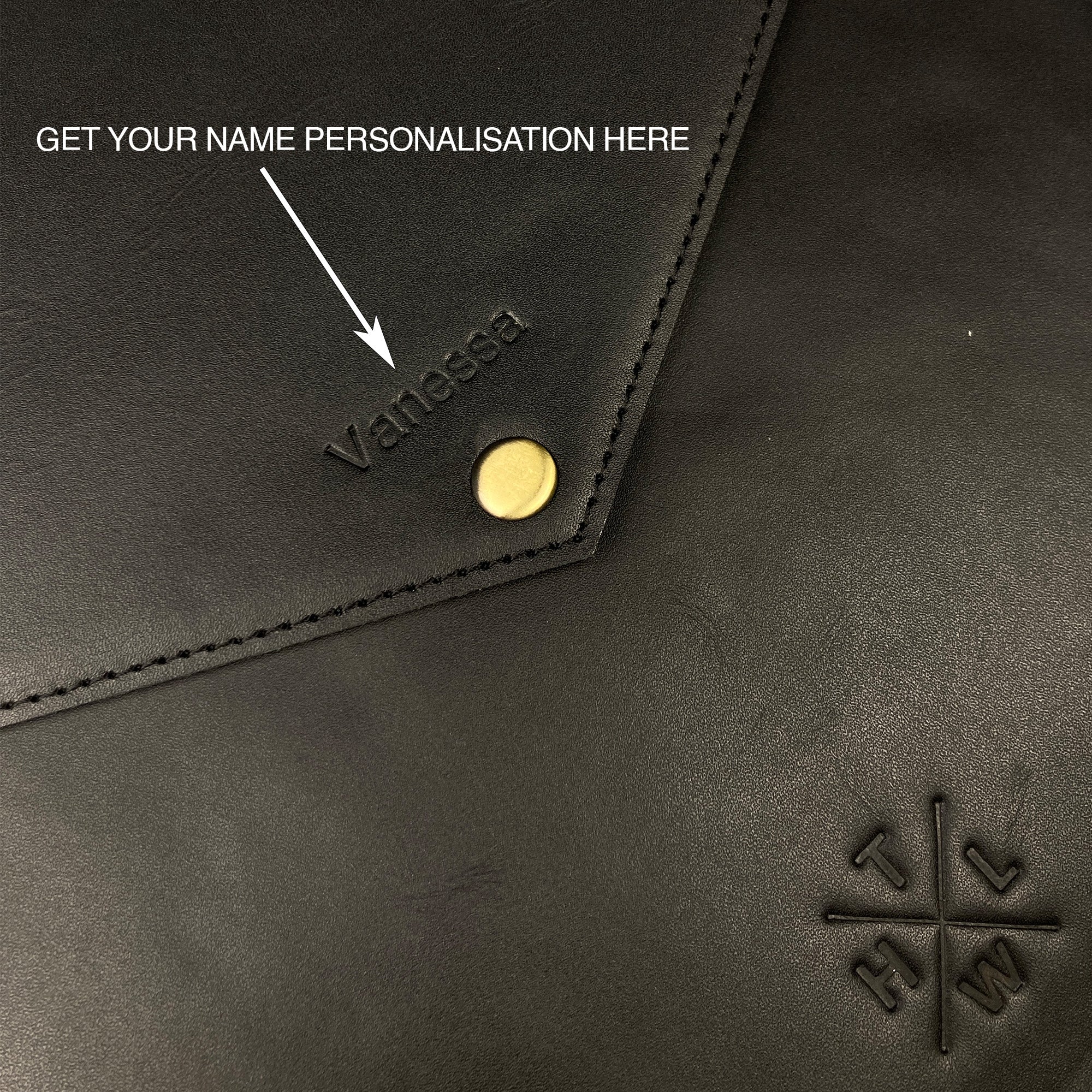 Black leather product with 'Vanessa' personalized name and a logo on a dark background