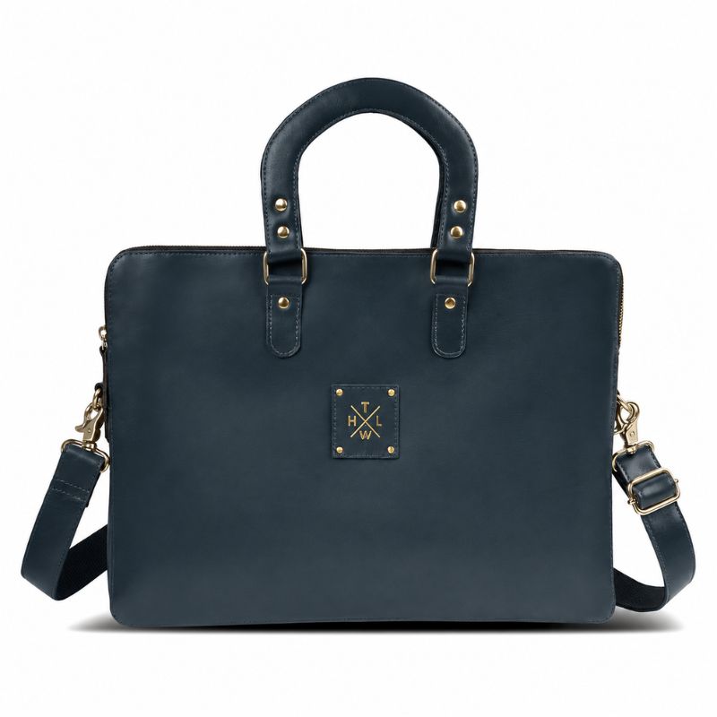 Navy blue handbag with gold accents on a white background