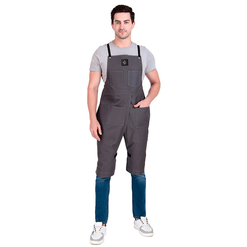Man wearing gray overalls on a white background