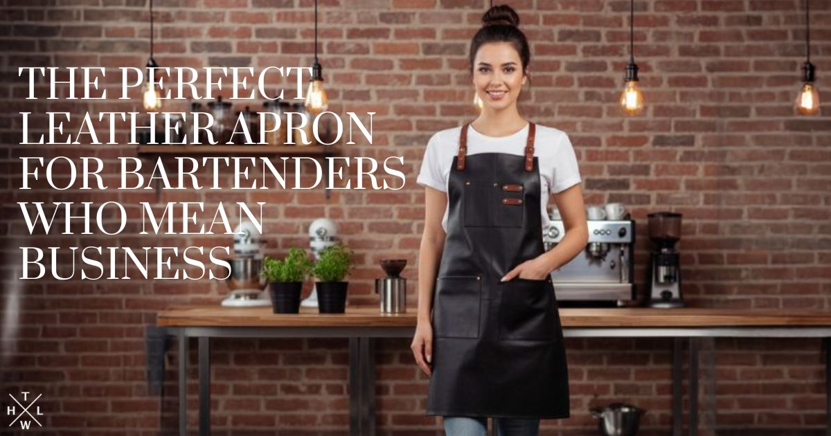 Female bartender wearing a stylish black leather apron with brown straps, standing confidently in a modern bar with brick wall background — featuring text that reads ‘The Perfect Leather Apron for Bartenders Who Mean Business