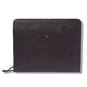 Black leather pouch with a gold button on a white background