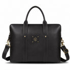 Black leather bag with gold accents on a white background