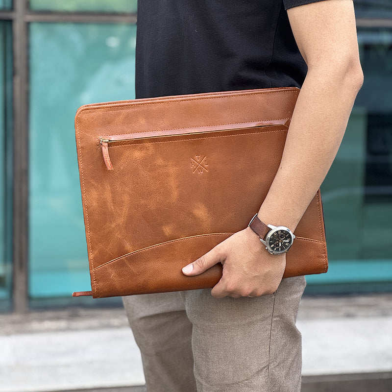 Leather lifestyle folder in hand