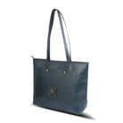 Blue tote bag with gold accents on a white background