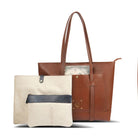 Two tote bags, one beige with a black zipper and the other brown, on a white background.