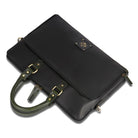 Black leather handbag with green handle on a white background