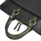 Black briefcase with green leather handles on a white background