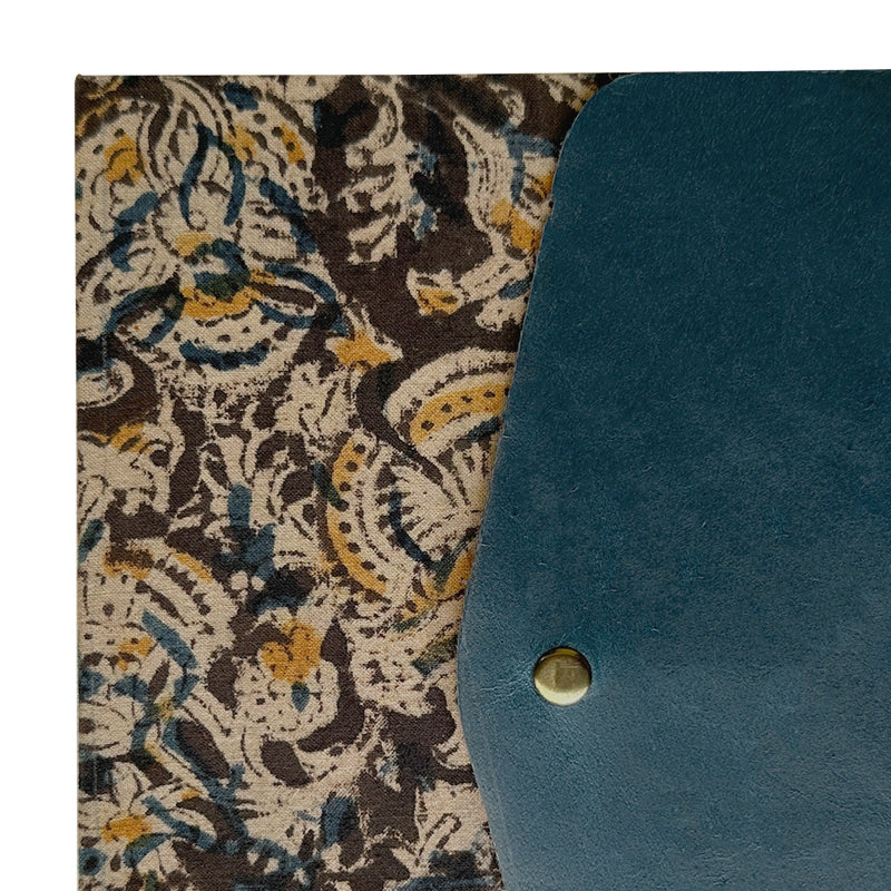 Teal leather case with a decorative patterned fabric background