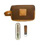 Brown toiletry bag with a pen holder and keychain on a white background