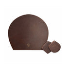 Brown leather placemat with two coasters on a white background