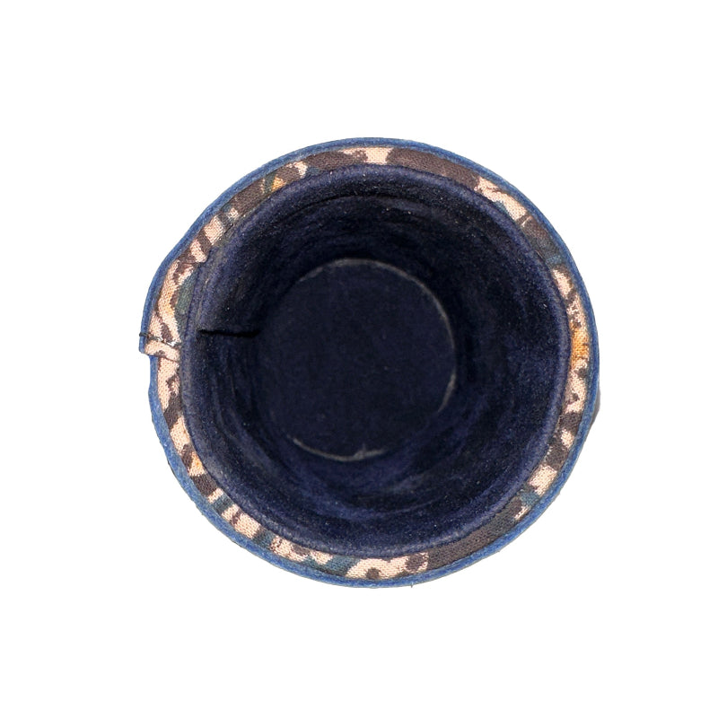 Navy blue cat bed with gold trim on a white background