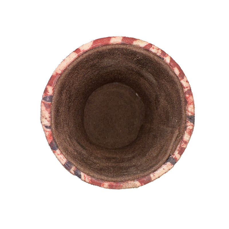 Top view of a flower pot with a decorative rim on a white background