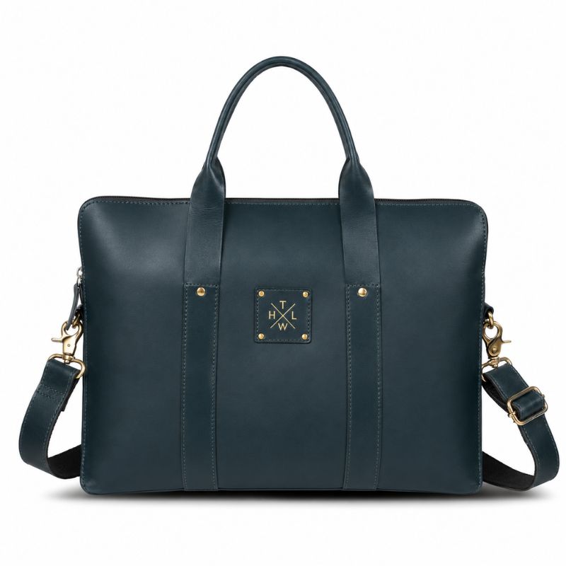 Blue leather laptop bag with gold accents on a white background