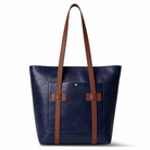 Blue tote bag with brown straps on a white background