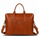 Brown leather bag with a visible brand logo on a white background