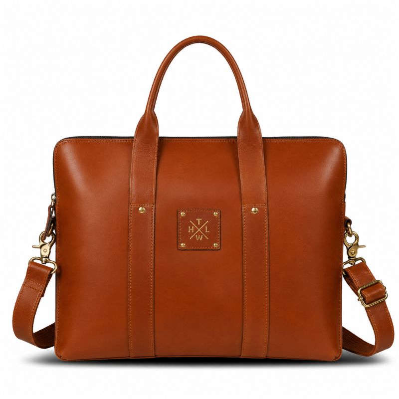 Brown leather bag with a visible brand logo on a white background