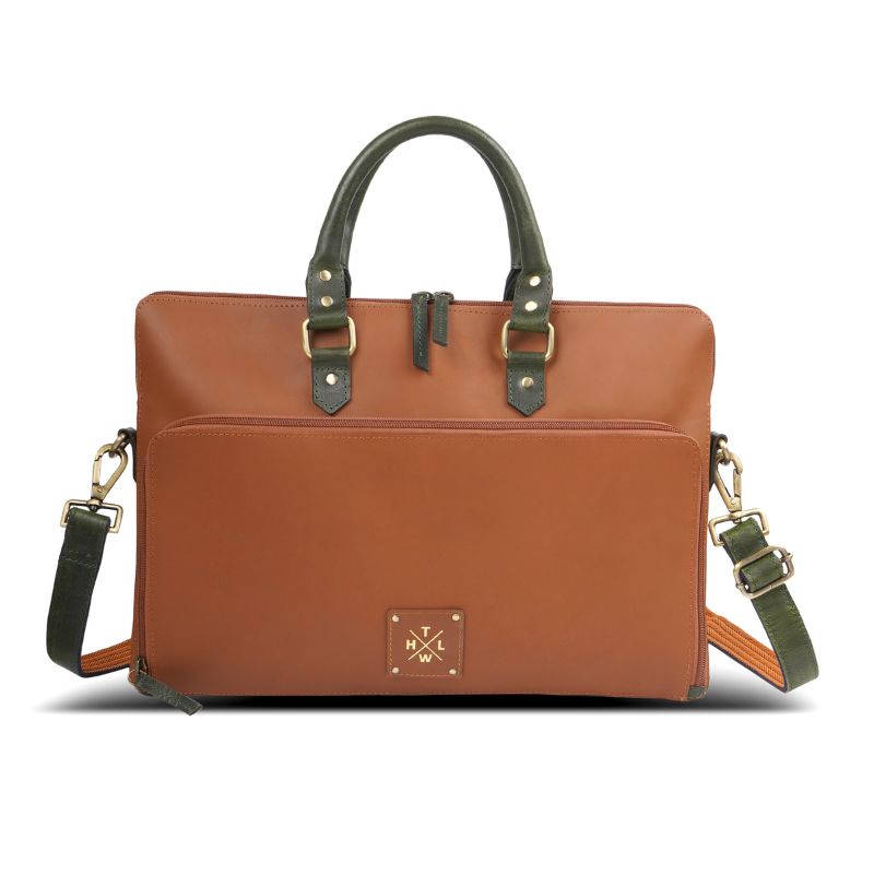 Front view of a brown leather laptop bag with navy handles and shoulder strap.