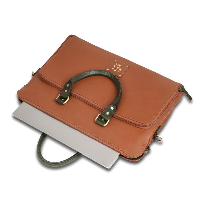 Top view of a brown leather laptop bag with dual handles and a shoulder strap.