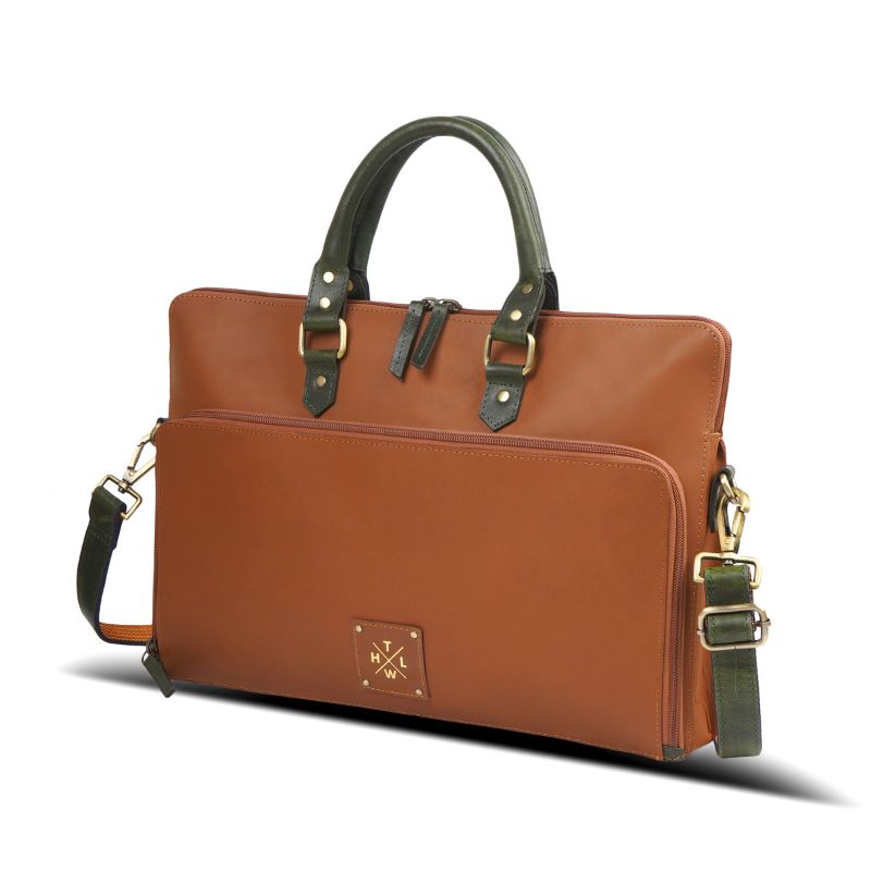 Side-angle view of a brown leather laptop bag with an adjustable shoulder strap.