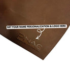 Brown leather placemat with 'PINAC' branding and text for personalization.