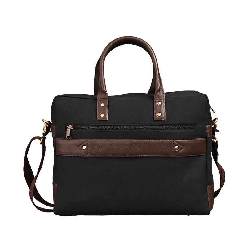 Black office laptop bag with brown leather handles and shoulder strap, featuring a front zip pocket and premium finish.