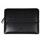 A black leather laptop sleeve with a front strap closure, gold-tone snap buttons, and a small embossed logo, shown on a plain white background.
