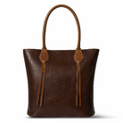 Brown leather tote bag with decorative straps on a white background