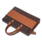Brown leather laptop bag  with a matching brown strap on a white background
