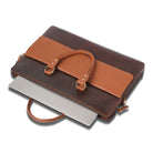 Brown leather laptop bag  with a handle on a white background
