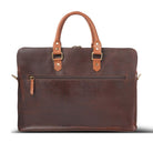 Brown leather laptop with gold accents on a white background