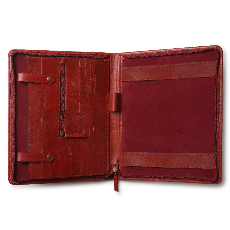 Open red leather document folder with multiple compartments, including card slots, a zipper pocket, pen holder, and large sleeves on both sides. The interior is fully lined in matching red material.