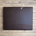 Brown leather file folder on a wooden surface with text for personalization.