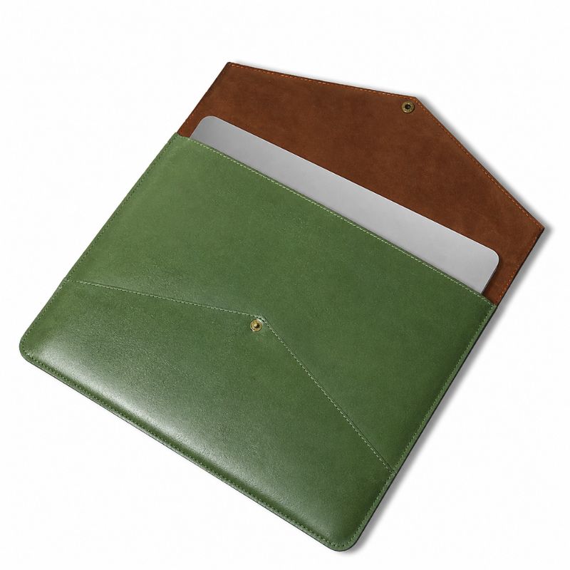 Green and brown leather laptop sleeve on a white background
