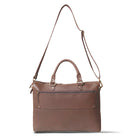 Brown leather handbag with a shoulder strap on a white background