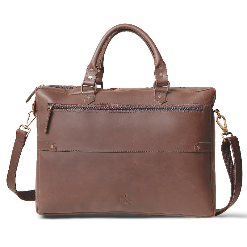 Brown leather briefcase with shoulder strap on a white background