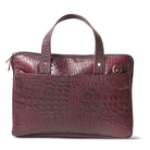 Maroon crocodile-patterned leather briefcase on a white background