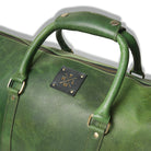 Green leather bag with a brand logo on a white background