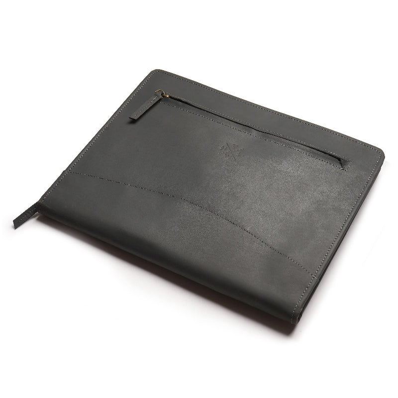 grey leather folder on desk 