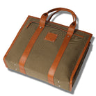 Brown leather-bound bag with a visible brand logo on a white background