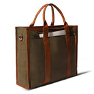 Brown tote bag with leather straps on a white background